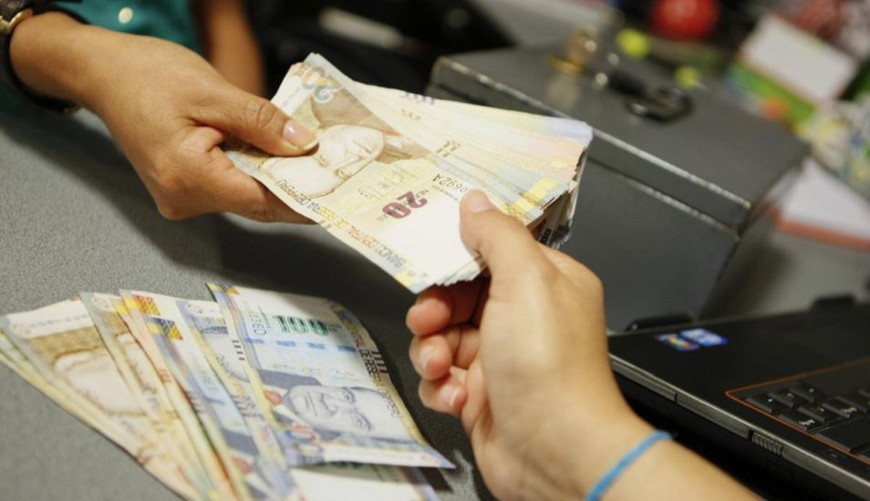 En el caso de trabajadores afiliados a una Empresa Prestadora de Salud (EPS), la bonificación extraordinaria no será el 9 %, sino el 6,75%. (Foto: Andina)